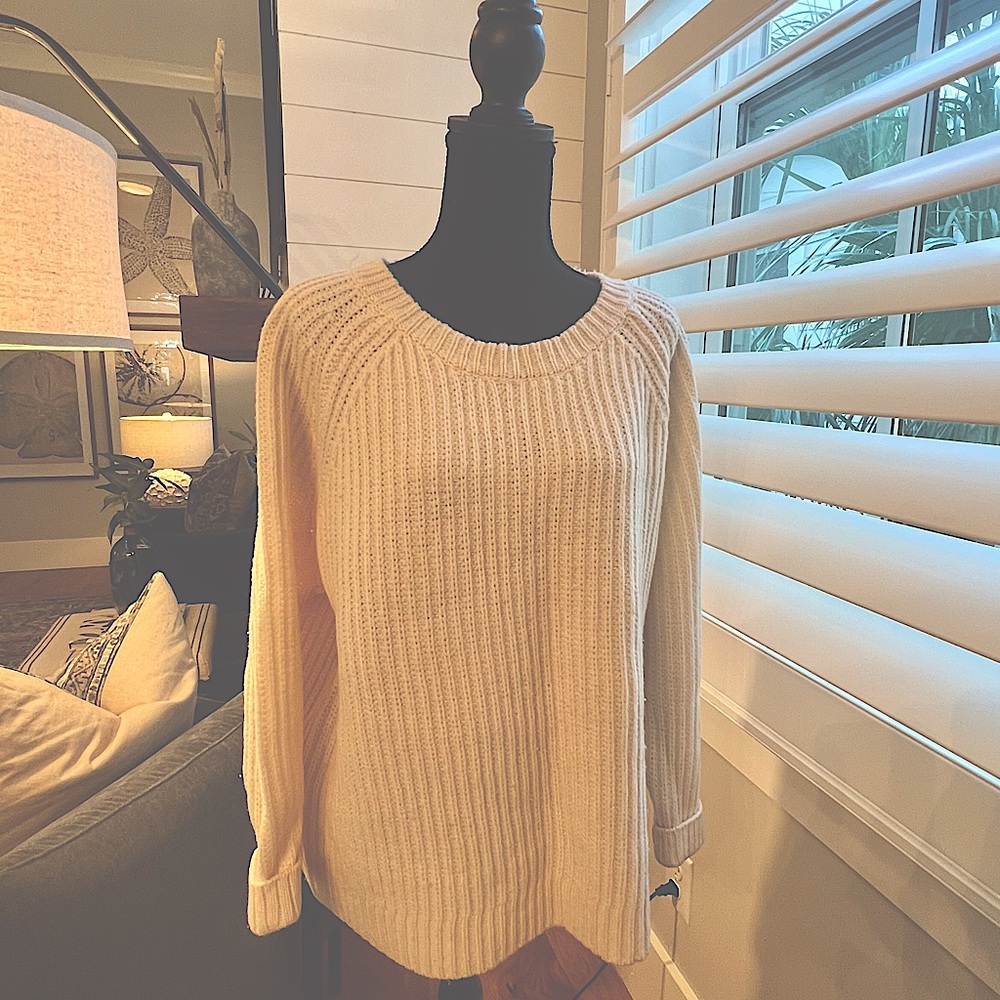 Ivory, 100 percent wool ribbed sweater.